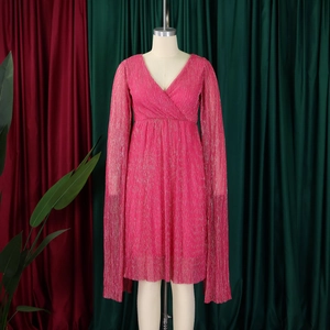 Detail of elegant V-neck magenta evening dress with metallic pleated fabric texture