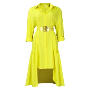Detail of high-low asymmetric hem and PVC belt on yellow shirt dress with button cuff