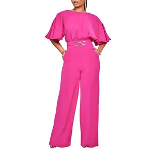 Detail of rose red wide-leg jumpsuit with bell sleeves and silver ring buckle belt