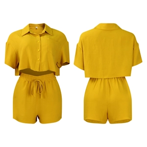 Front and back view of mustard yellow linen blend two-piece shirt and shorts set