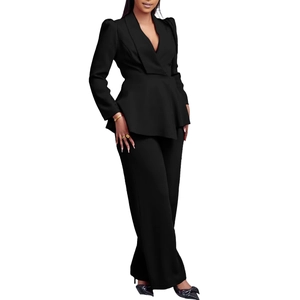 Detail of elegant black two-piece set featuring peplum blazer and wide-leg trousers