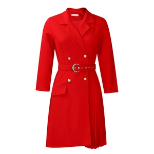 Detail view of red double-breasted blazer dress with metallic buttons and pleated hem