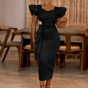 Detail of elegant black dress with ruffle sleeves, rhinestone buckle, and pleated skirt