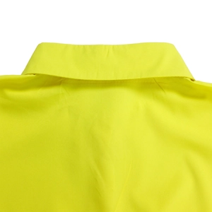 Detail view of the classic turn-down collar and fine fabric texture of a lemon yellow shirt