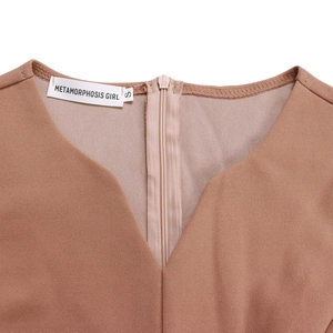 Detail view of V-neckline and back zipper on this solid camel color pleated dress