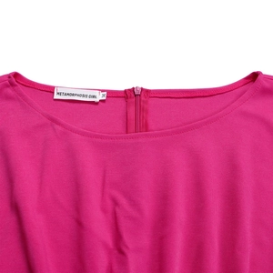 Detail of round neckline and back hidden zipper on fuchsia high waist jumpsuit