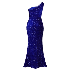 Close-up of sparkling royal blue sequins on one-shoulder fishtail evening gown fabric