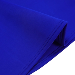 Detail shot of royal blue dress showing high-quality double stitching and textured fabric