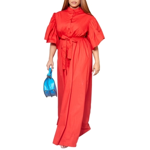 Detail of the elegant red summer maxi dress featuring flare sleeves and a belted waistline