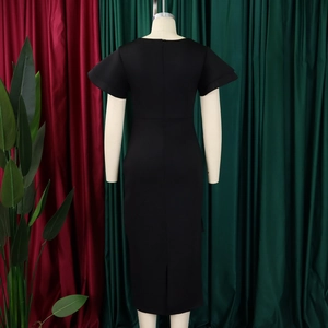 Detail view of the elegant black bodycon dress featuring layered ruffle sleeves and back slit