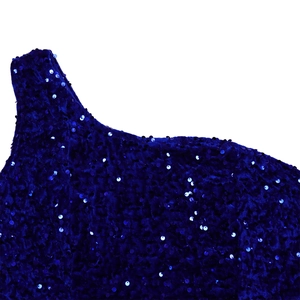 Detailed macro shot of deep blue sequins sewn on premium velvet evening dress fabric