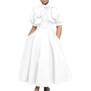 Close-up of elegant oversized bow neckline and puff sleeves on white party dress