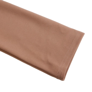 Detail of pleated three-quarter sleeve cuffs with durable double stitching in terracotta