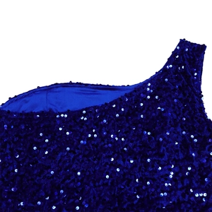 Detailed macro view of dark blue sequins and premium satin lining on a one-shoulder evening gown