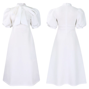 Detailed flat lay of white A-line dress with puff sleeves and oversized bow tie back