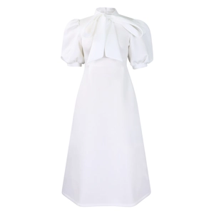 Detailed view of white midi dress with puff sleeves and elegant large bow tie neckline