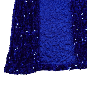 Detail of royal blue sequined fabric showing shiny metallic texture and inner pleats