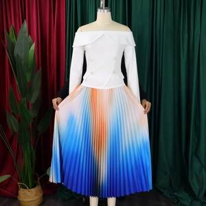 Detail of off-shoulder white top with pearl buttons and colorful pleated gradient skirt
