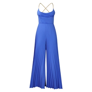 Detail of royal blue jumpsuit showing chain straps, back cross, and pleated wide legs