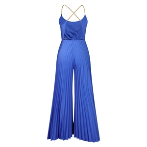 Detail of royal blue wide-leg jumpsuit featuring pleated fabric and gold chain straps
