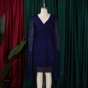 Detail of elegant V-neck cocktail dress in glittery navy fabric with cape sleeve design