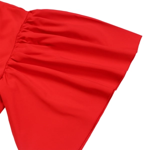 Close-up of bright red flared sleeves with soft ruffles and smooth draped fabric detail