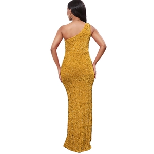Detailed back view of a gold sequin one-shoulder evening gown with a high-slit and slim fit