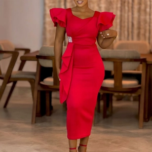 Detailed view of elegant red dress with ruffle sleeves and rhinestone buckle decoration