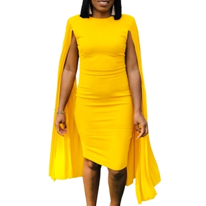 Close-up of bright yellow sleeveless dress featuring elegant pleated cape detailing