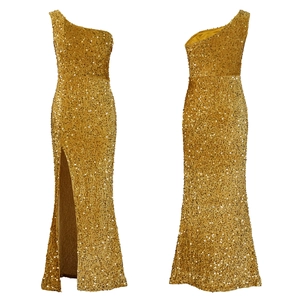 Detail of elegant gold one-shoulder sequin evening dress with a high side slit
