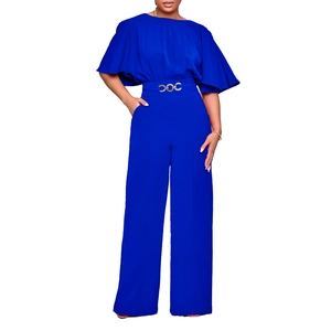 Detail of royal blue jumpsuit showing elegant cape sleeves and high waist belt detail