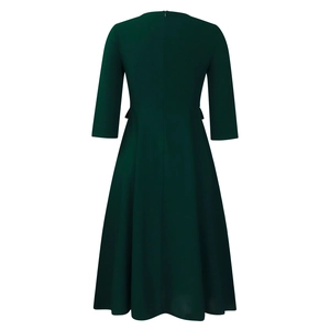 Rear view of dark green A-line dress featuring three-quarter sleeves and invisible back zipper