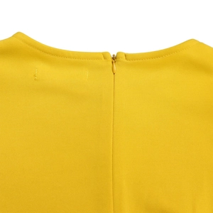 Detail view of yellow party dress neckline featuring pleats and hidden back zipper