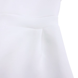 Detail of waist stitching and pleated texture on a white formal summer party dress