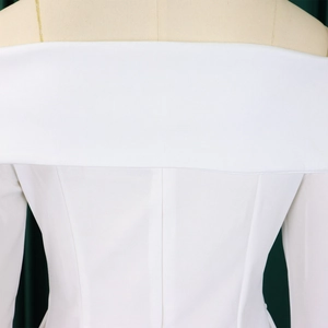 Detail of white off-the-shoulder top with elegant fold design and clean stitching