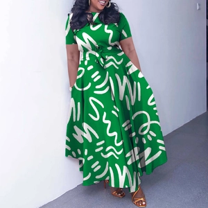 Detail view of African style green maxi dress with white abstract wave print and waist tie