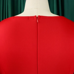 Detail shot of the back neckline featuring a matching invisible zipper on a red ruffle dress