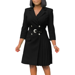 Detail of black blazer dress showing pleated patchwork skirt and silver crescent buckle belt