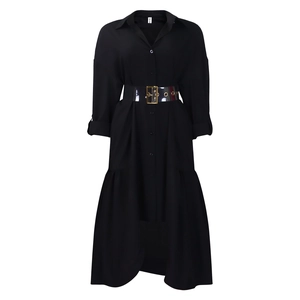 Detail of a black shirt dress featuring an irregular hem and transparent PVC waist belt