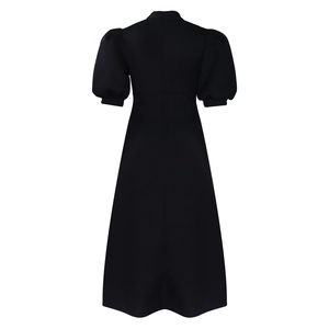 Back view of a black puff sleeve A-line dress with a concealed zipper and high neck