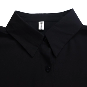 Close-up of the collar and brand label on a black casual shirt dress for women