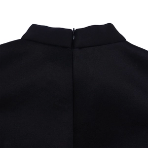Close-up of the high neck design and hidden back zipper on the black party dress