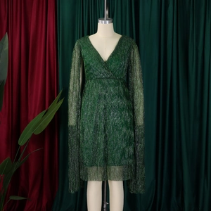 Detail of dark green V-neck dress with glitter fabric and cape slit sleeves for parties