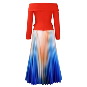 Detail of off-shoulder red top with pleated gradient skirt showing fabric texture