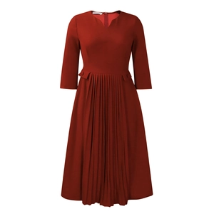 Detail of burgundy V-neck pleated dress featuring three-quarter sleeves and high waist design
