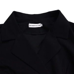 Detailed close-up of the blazer dress collar with fabric texture and size label