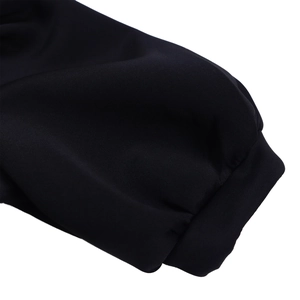 Detail of high-quality black ribbed cuffs on a short sleeve evening dress with soft texture