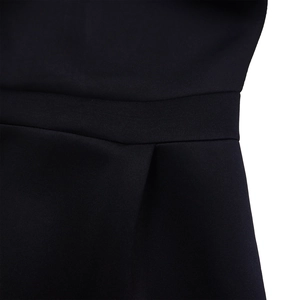 Detailed close-up of pleated waist design and high-quality woven fabric texture