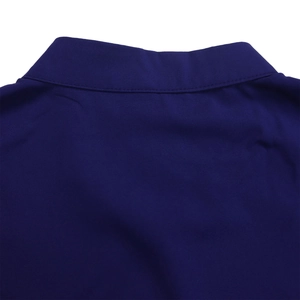 Detailed view of dark blue shirt collar featuring precise stitching and high-quality fabric