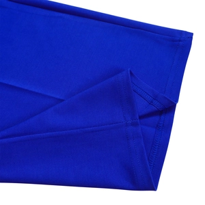 Detailed close-up of blue jumpsuit double-needle hem stitching and fine fabric texture